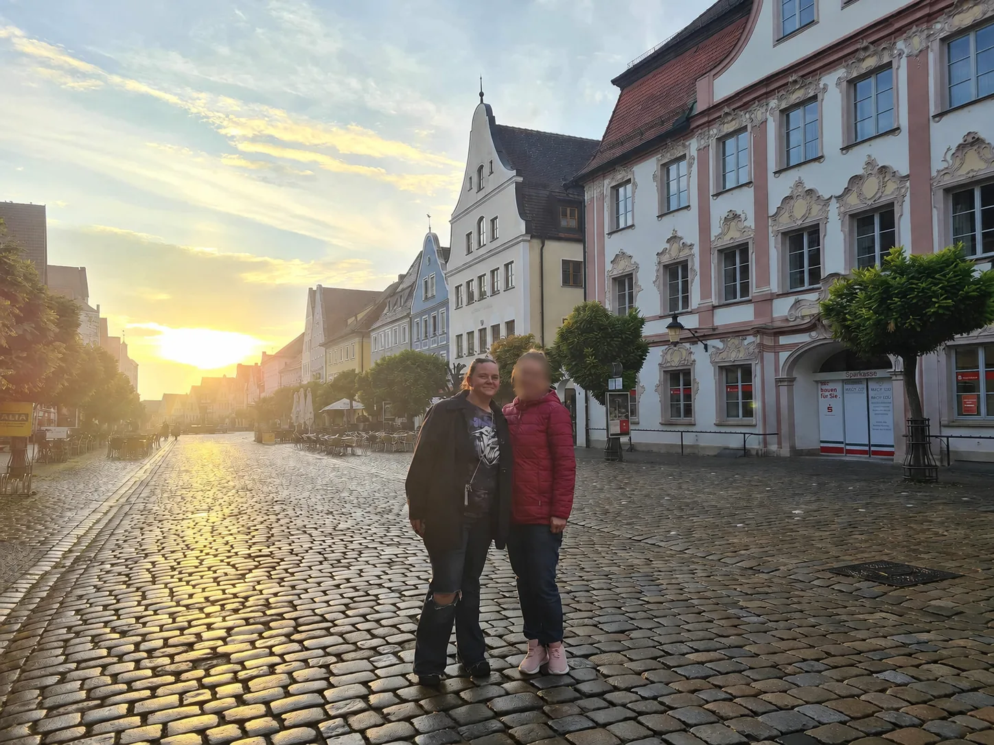 Danielle in a historic cobblestone square in Günzburg, Germany